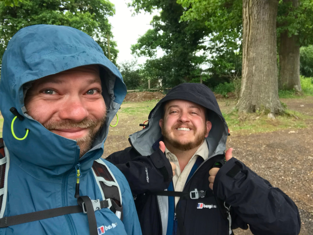 selfie of two people in raincoats