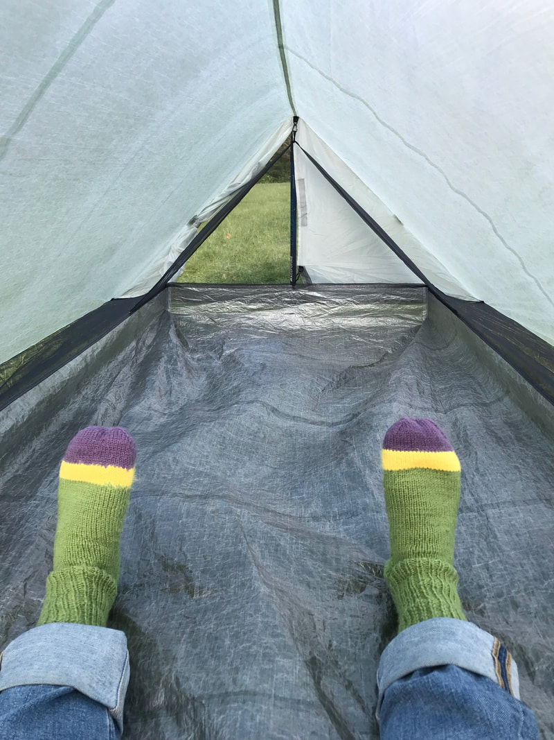 Tent interior with striped socks