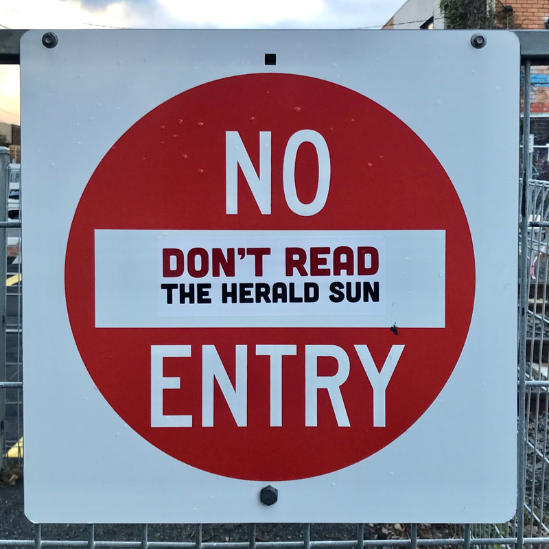 official no entry sign with an added sticker saying DON'T READ THE HERALD SUN