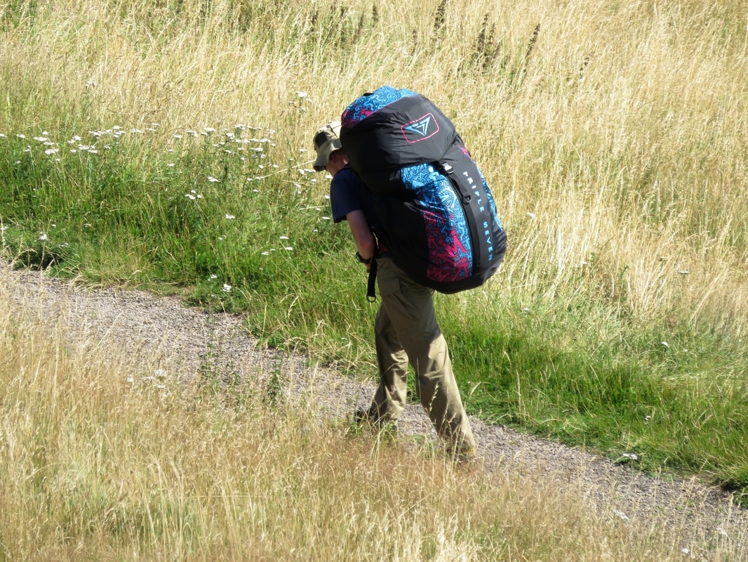 person walking with large pack