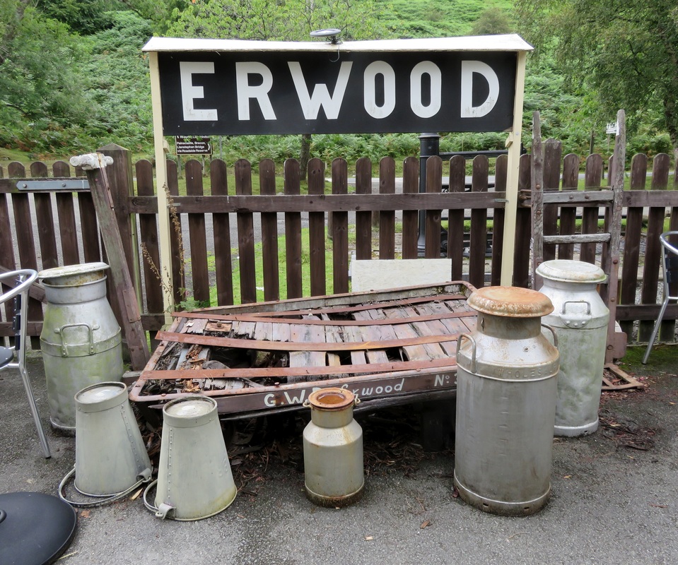 Station sign and milk churns