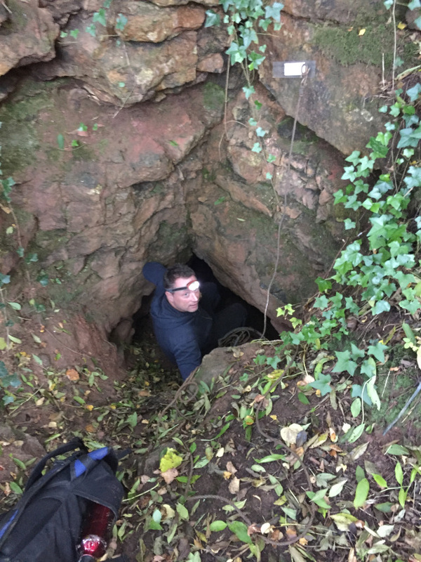 Person descending into a cave