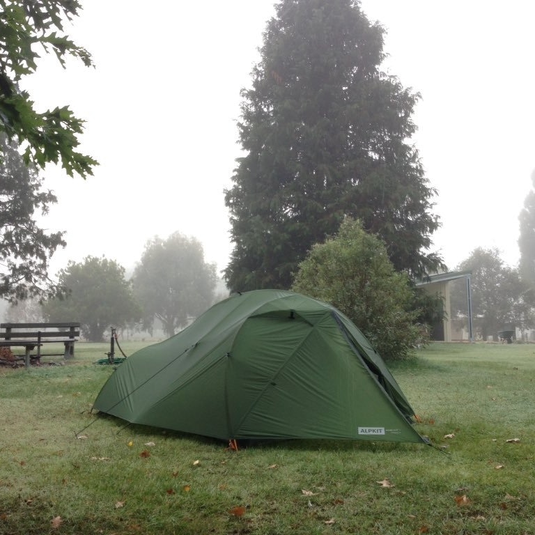 Green tent in rain