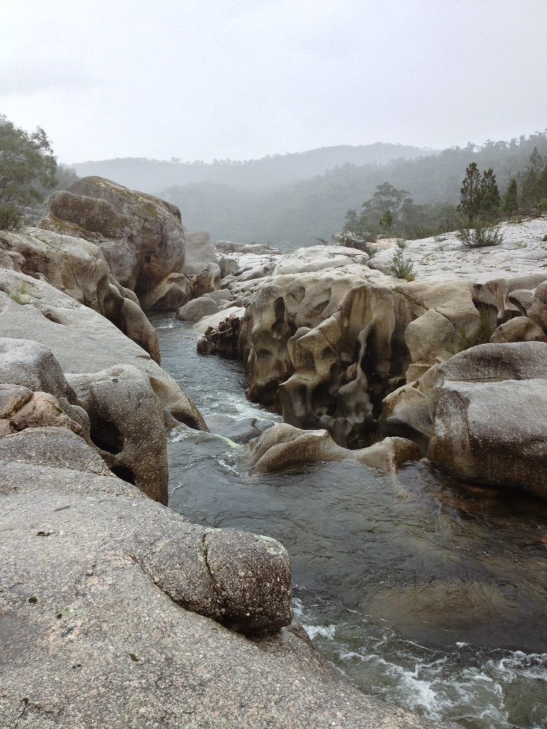 River, granite boulders and rain