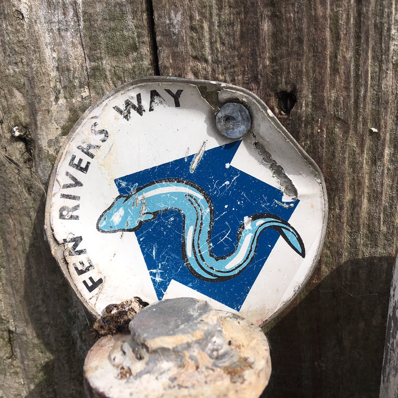 Waymarker with an eel on it
