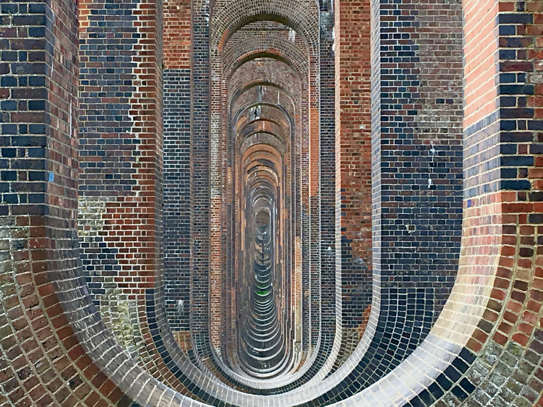 looking through the vaulted brick arches of the viaduct