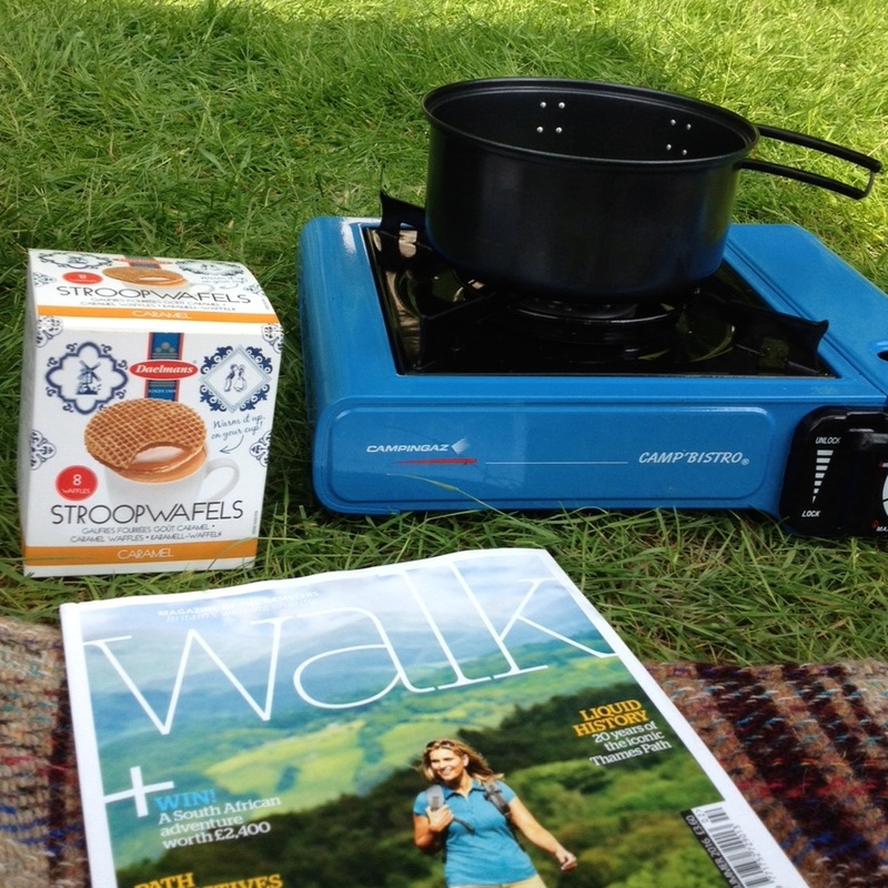 Campstove and pot, biscuit box, magazine