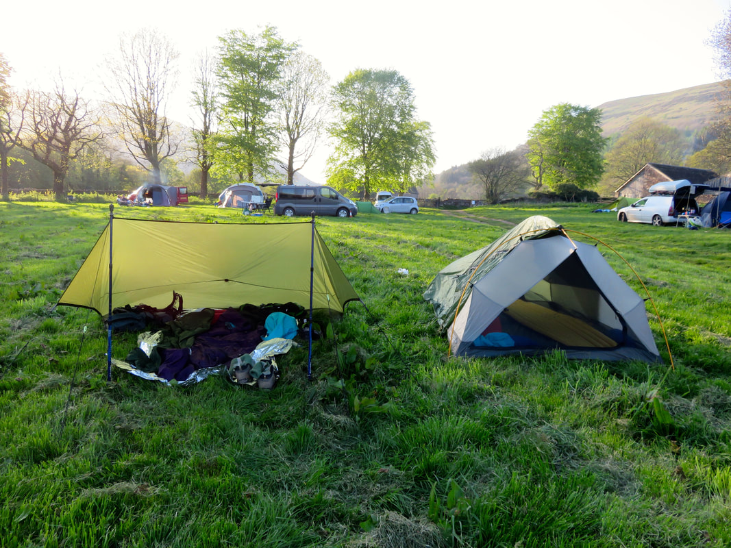 tarp and tent in campsite