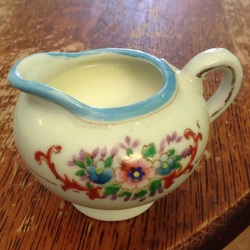 Milk in a small flower-patterned jug
