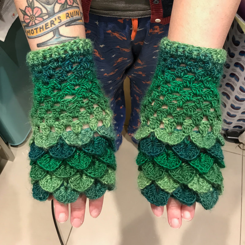 Green dragon scale crochet gloves