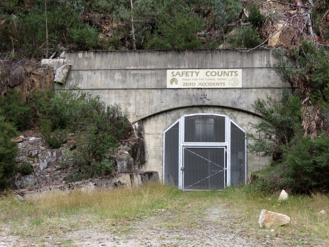 Entrance to tunnel with 'safety counts' sign