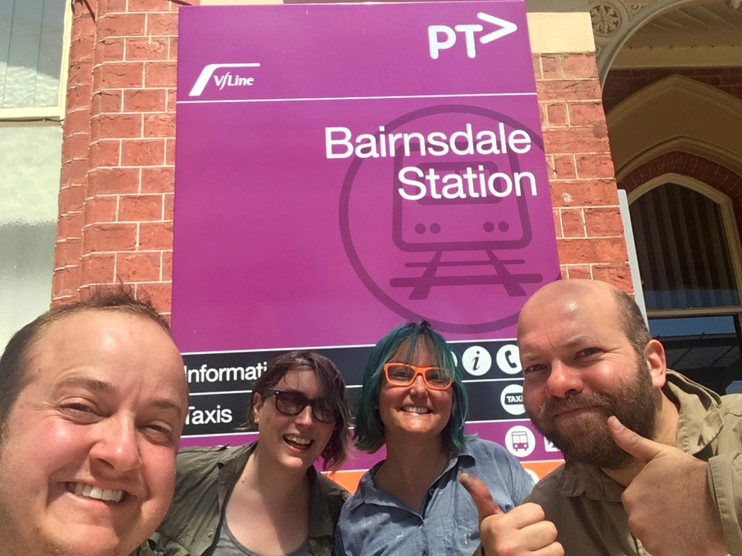 Selfie - four smiling people with Bairnsdale Station sign