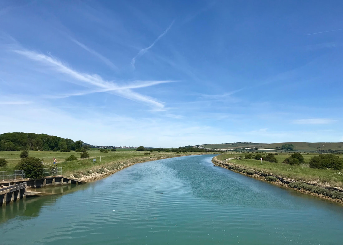 blue green river and blue sky
