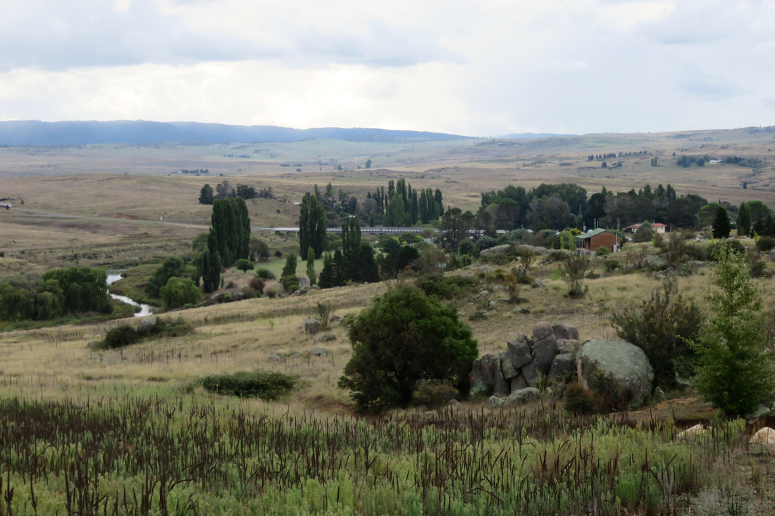 monaro plains with small town in river valley
