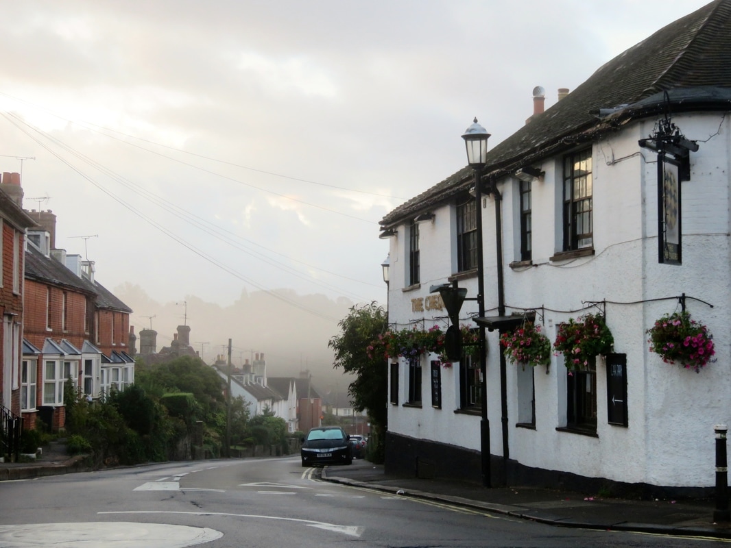 misty road and pub