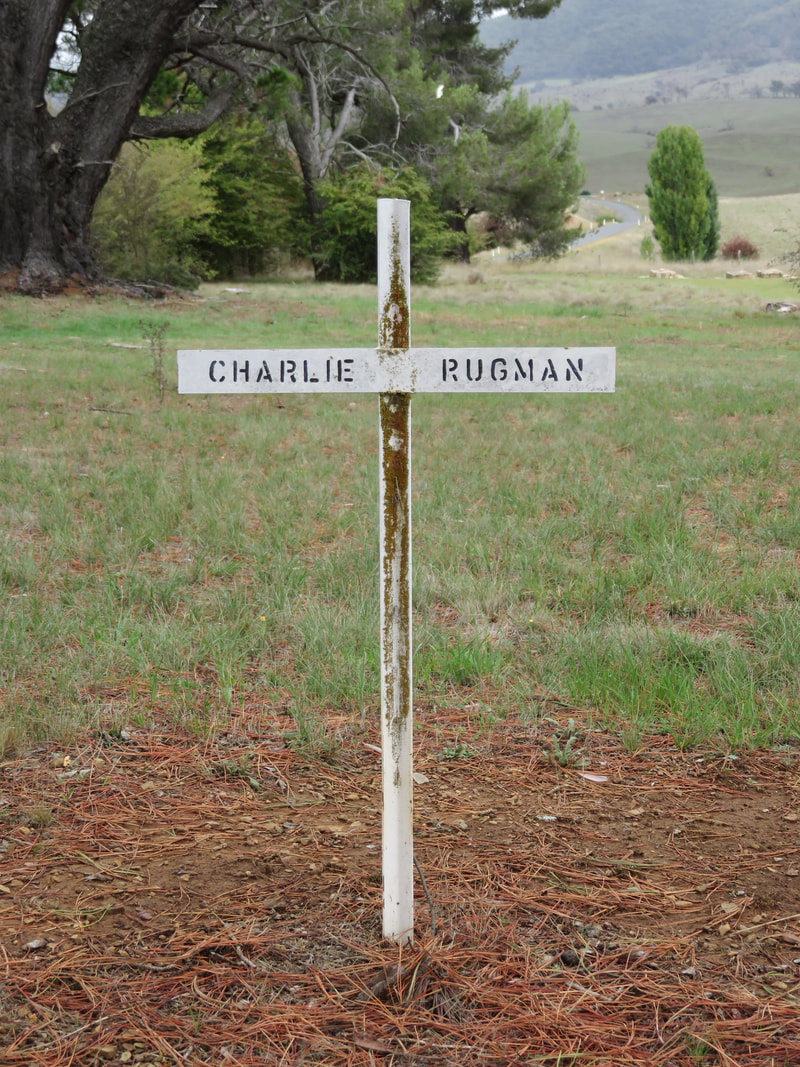 white cross labelled charlie rugman